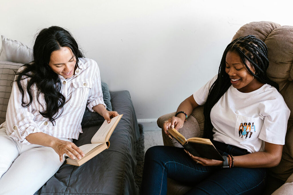 Two Young Women Reading Books